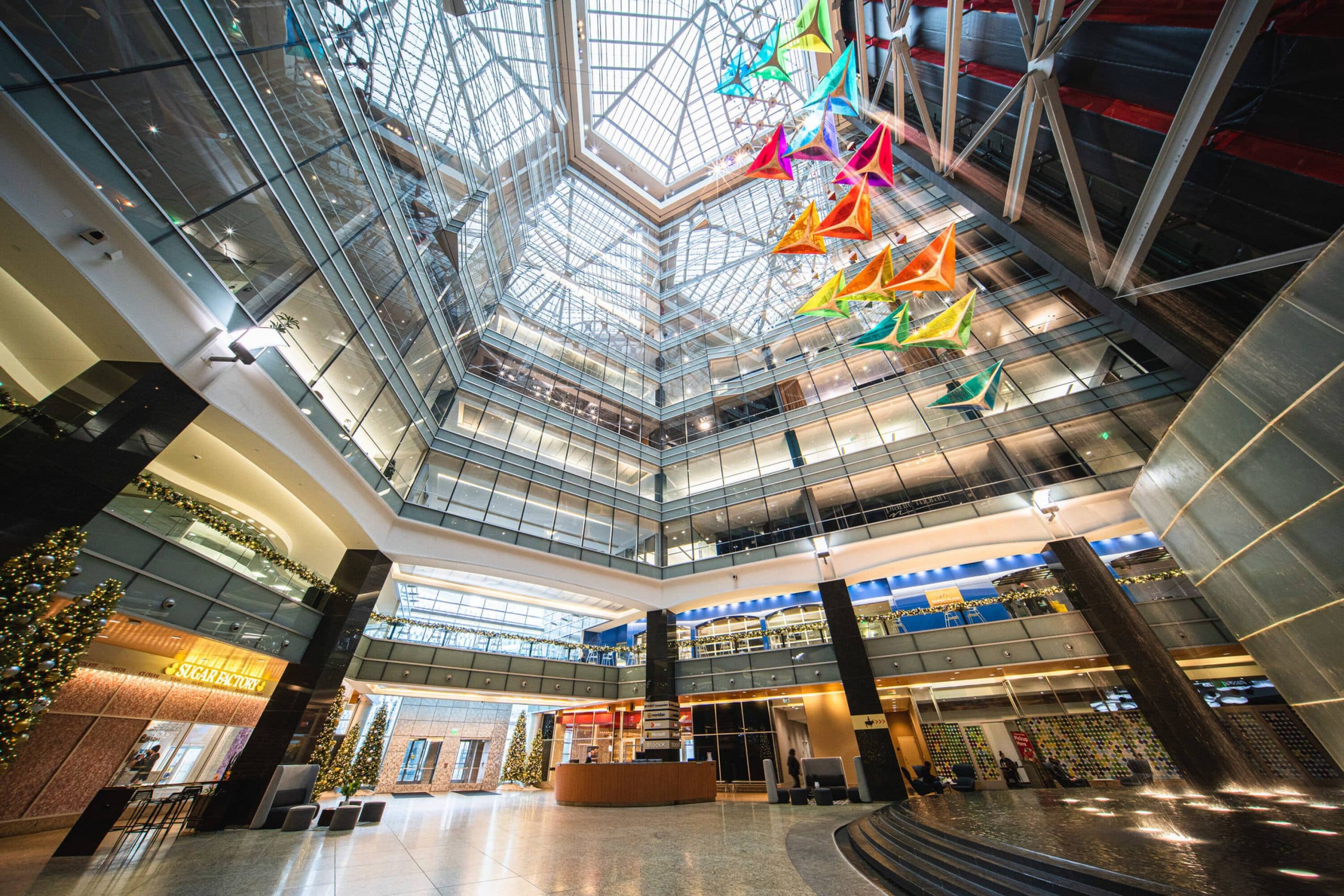 Lobby Atrium at One Campus Martius looking up into the skylight with the indoor water feature running during the holiday season.